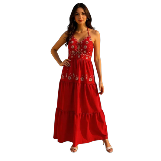 Woman wearing a red dress with floral patterns on a white background
